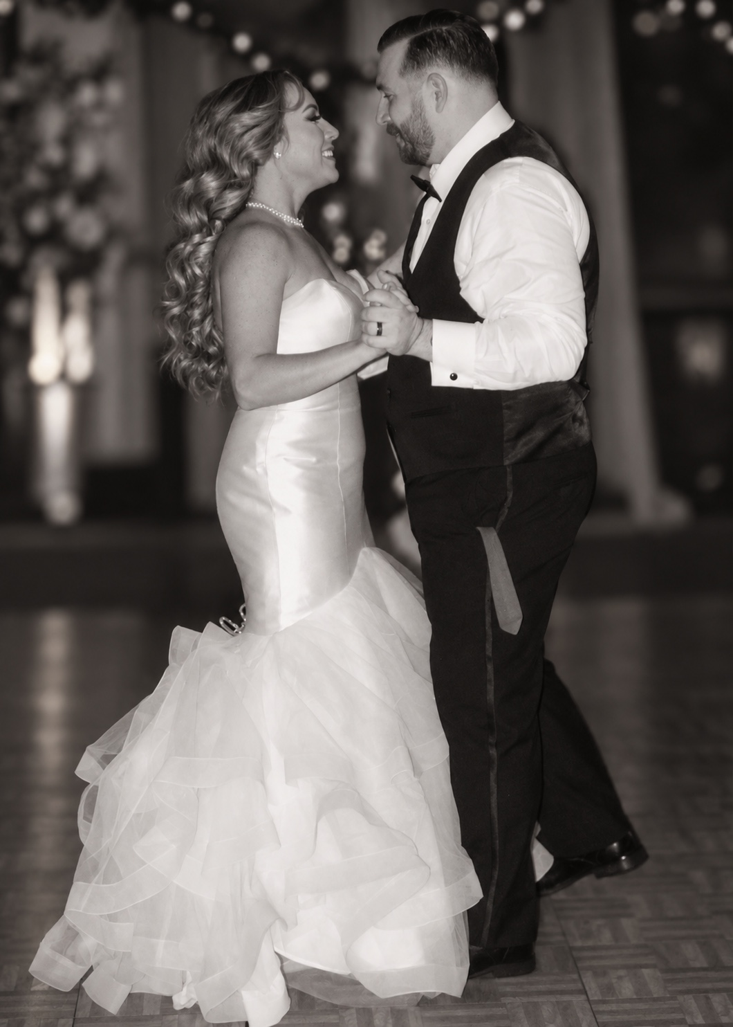 Bride wearing long polished curls by Capuano Bridal